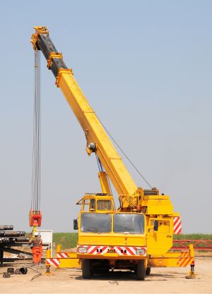 mobile crane lifting a large load at a construction site